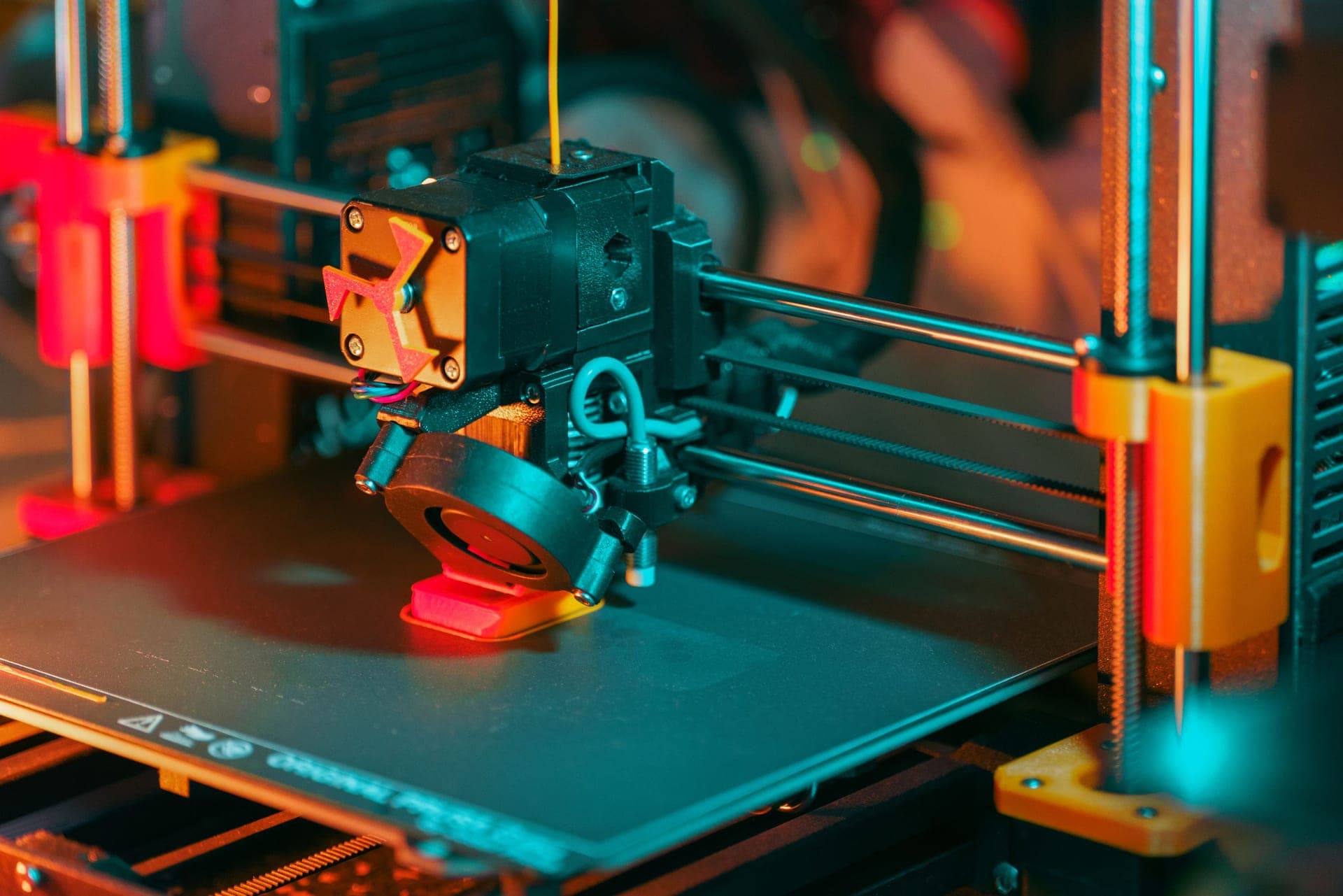 A resin printer with a finished model still on the build plate